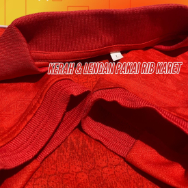 Jersey merah kera dan lengan